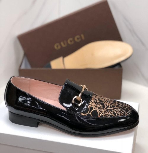 Black patent leather loafer-style shoe, lik