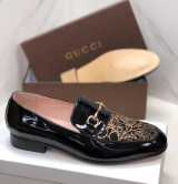 Black patent leather loafer-style shoe, lik